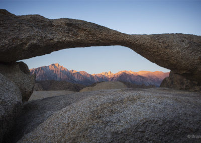 Arch and mountains at dawn