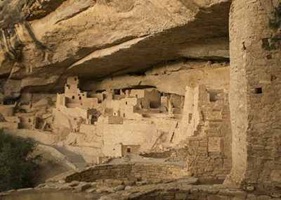 Cliff dwellings under darkened skies