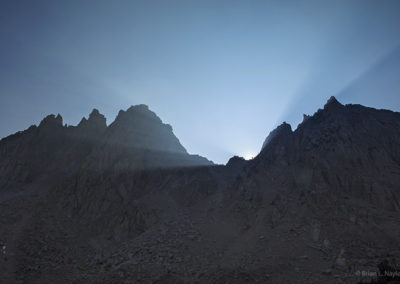 Blazing light rays over high alpine ridge