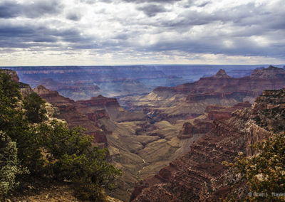 Light rays breaking unto canyon floor