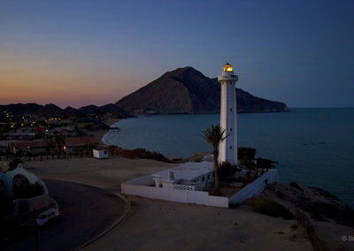 Lighthouse coastline under evening light