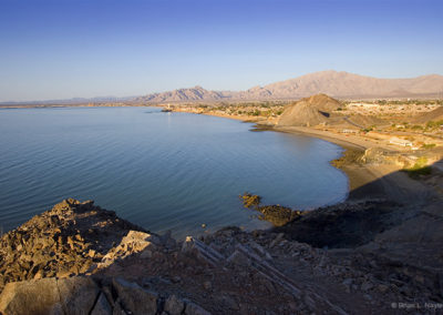 Desert coastline on still seas