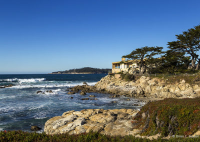 Seaside home on rocky outcrop overlook azure waters