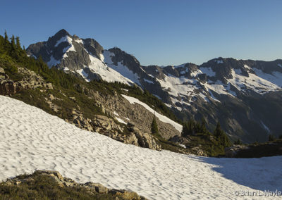 Snowy alpine peaks in afternoon sun