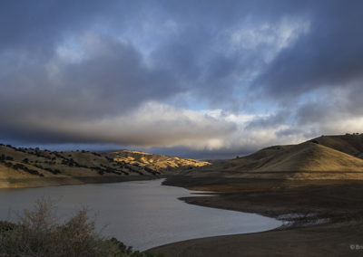 Lake underneath dramatic skies