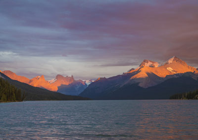 Lake and mountains under golden light