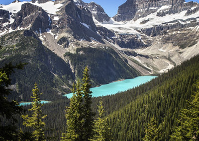 Turquoise lake backed by mountain peaks