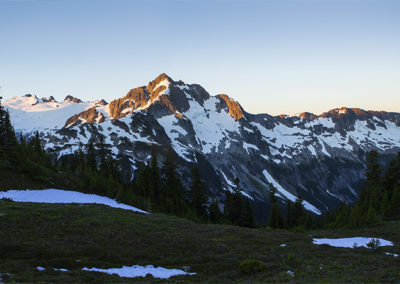 Mountain peak fringed by early morning light