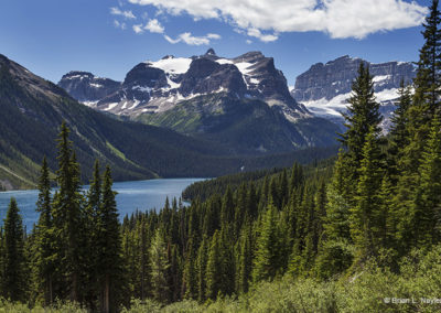 Mountain lake under bright skies