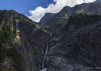 Glacier melt cascades down mountain face