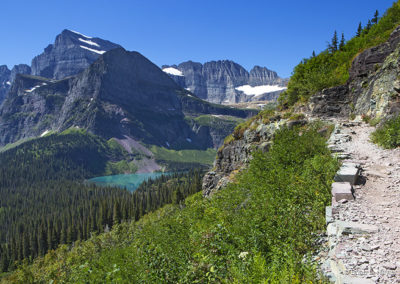 Blue greenBlue green lake surrounded by alpine glaciers and forest