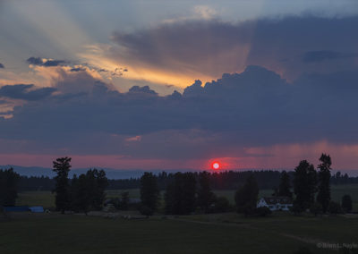 Sunset below rain swollen clouds