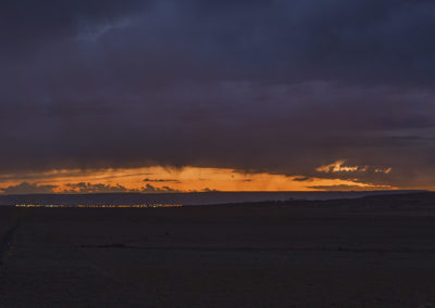 Last light and ominous clouds over the desert