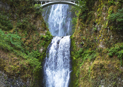 Arch bridge over waterfalls in the Colombia gorge