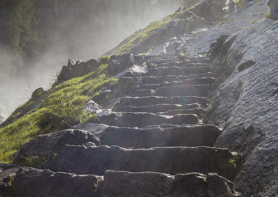 Stone steps into waterfall mist