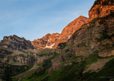 Morning sun highlights mountain peaks