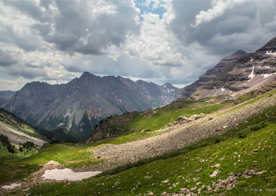 Mountains and meadows under dramatic skies