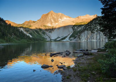 Still morning waters on the mountain lake