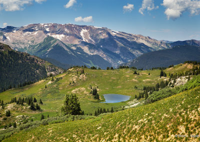 A small lake waters the high mountain pastures