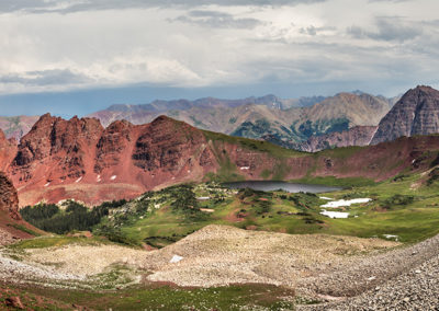 Panoramic view across moraines and distant mountains