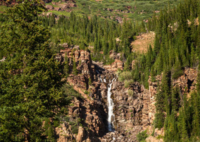 Waterfall plunges over the rocky crags